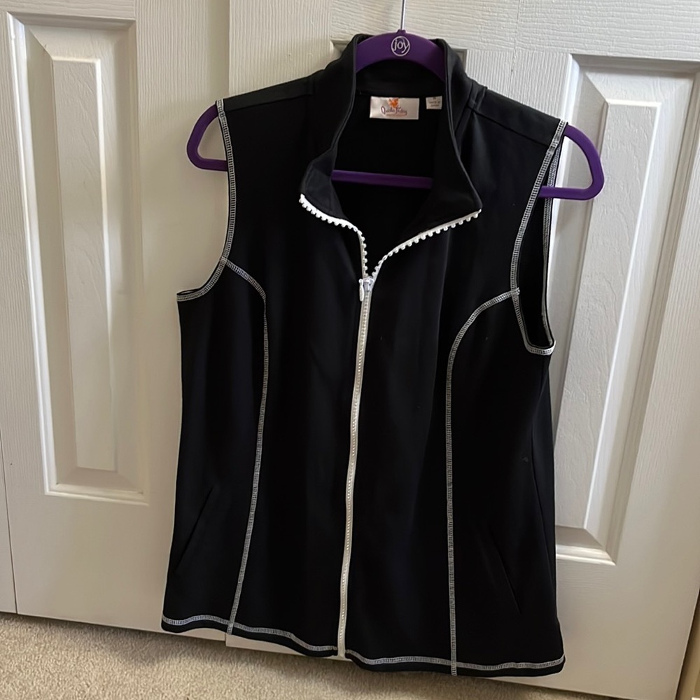 Black and white vest size medium with white zipper with rhinestones